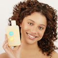 girl holding Dry Hair Shampoo 