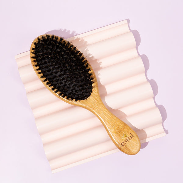 https://www.esmiskin.com/cdn/shop/products/esmi_BambooHairBrush_Lifestyle2_WEB_2500.jpg?v=1658795355&width=600